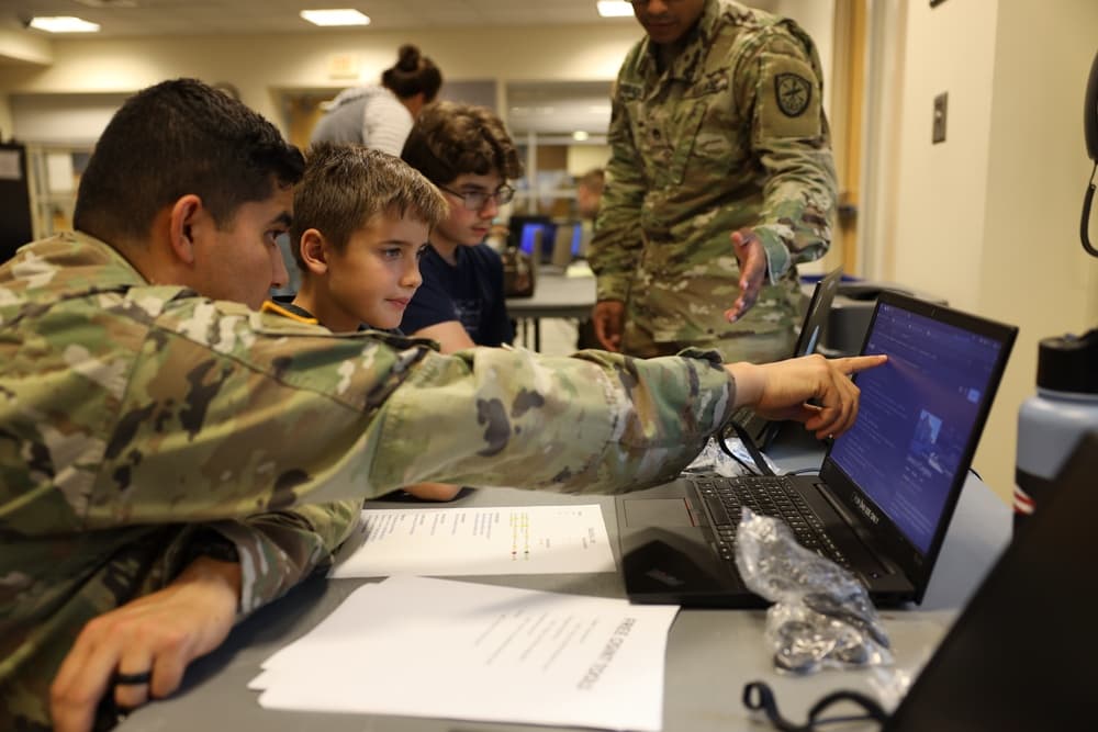 Cybersecurity students working through an OSINT tools station